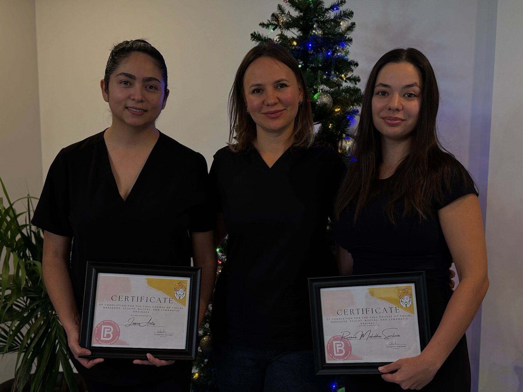 Face Bliss Academy graduates holding professional certificates